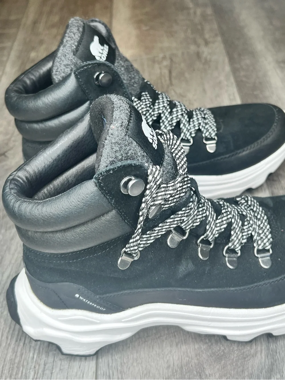 Sorel Black Lace-Up Winter Boots with White Accents